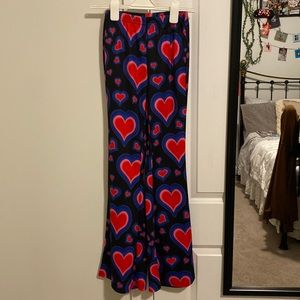 Heart flared pants. Stretchy material, Size S/M. Never worn